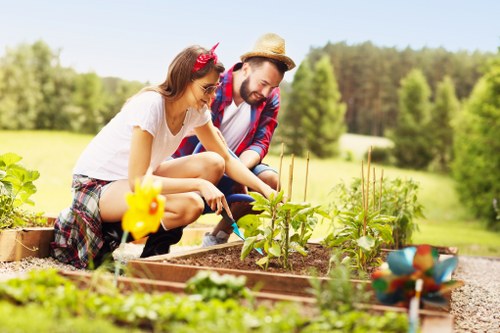 Team of gardeners with tools preparing a site